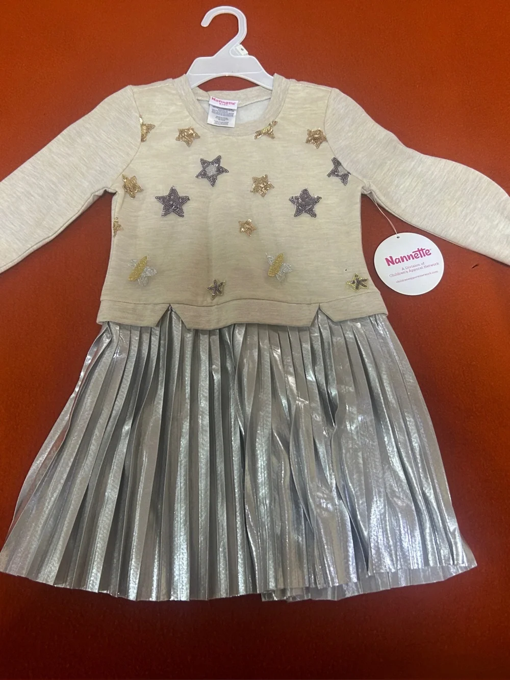 Nannette Cream Top with Silver Metallic Pleated Skirt and Star Accents